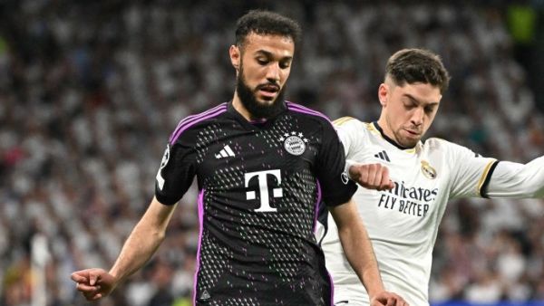 Bayern Munich's Moroccan defender #40 Noussair Mazraoui and Real Madrid's Uruguayan midfielder #15 Federico Valverde vie for the ball during the UEFA Champions League semi final second leg football match between Real Madrid CF and FC Bayern Munich at the Santiago Bernabeu stadium in Madrid on May 8, 2024. (Photo by JAVIER SORIANO / AFP)