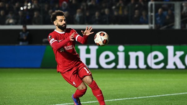 Liverpool's Egyptian forward #11 Mohamed Salah celebrates after scoring a penalty kick during the UEFA Europa League quarter-final second leg football match between Atalanta BC and Liverpool FC at the Atleti Azzurri d'Italia Stadium in Bergamo, on April 18, 2024. (Photo by Isabella BONOTTO / AFP)