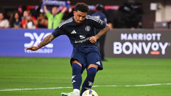 Manchester United's forward #25 Jadon Sancho scores a penalty kick during the pre-season club friendly football match between Manchester United FC and Arsenal FC at SoFi Stadium in Inglewood, California on July 27, 2024. (Photo by Patrick T. Fallon / AFP)