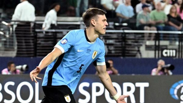 Uruguay's midfielder #05 Manuel Ugarte celebrates after scoring in a penalty shoot-out to win the Conmebol 2024 Copa America tournament quarter-final football match between Uruguay and Brazil at Allegiant Stadium in Las Vegas, Nevada on July 6, 2024. (Photo by Robyn Beck / AFP)