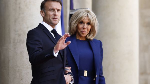 France's President Emmanuel Macron (L) and France's first lady Brigitte Macron. (Photo by Sameer Al-Doumy / AFP) Brigitte Macron