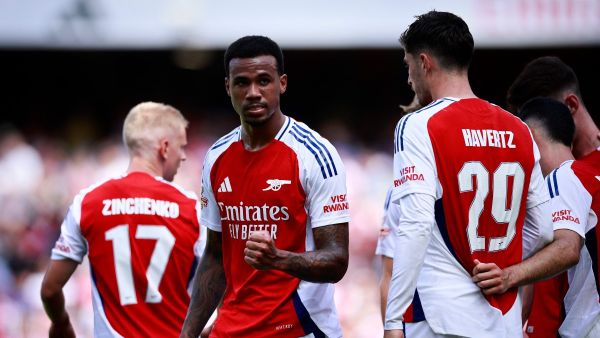 Arsenal's Brazilian defender #06 Gabriel Magalhaes celebrates scoring the team's second goal during the pre-season friendly football match for the Emirates Cup final between Arsenal and and Lyon, at the Emirates Stadium in London on August 11, 2024. (Photo by BENJAMIN CREMEL / AFP)