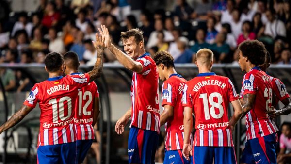 Atletico Madrid's Alexander Sorloth (3L) celebrates a goal with teammates during a friendly football match between Hong Kong’s Kitchee and Spain's Atletico Madrid at the Hong Kong stadium in Hong Kong on August 7, 2024. (Photo by Isaac LAWRENCE / AFP)
