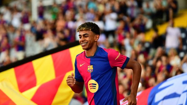 Barcelona's Spanish forward #19 Lamine Yamal arrives during a presentation prior the 59th Joan Gamper Trophy football match between FC Barcelona and AS Monaco at the Estadi Olimpic Lluis Companys in Barcelona on August 12, 2024. (Photo by MANAURE QUINTERO / AFP)