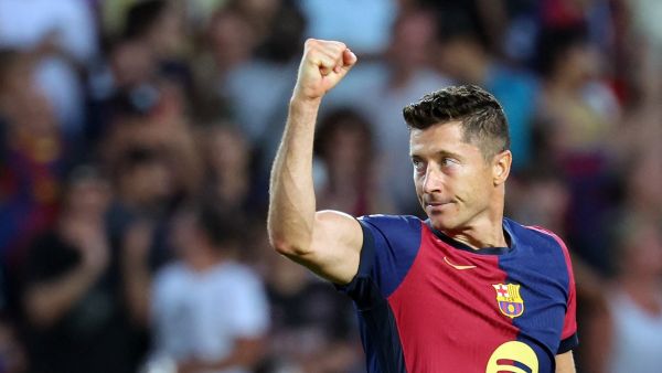 Barcelona's Polish forward #09 Robert Lewandowski celebrates scoring his team's second goal during the Spanish league football match between FC Barcelona and Athletic Club Bilbao at the Estadi Olimpic Lluis Companys in Barcelona on August 24, 2024. (Photo by LLUIS GENE / AFP)