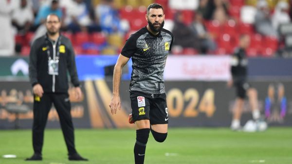 Ittihad's French forward #09 Karim Benzema warms up ahead of the Saudi Super Cup final football match between Al-Ittihad and Al-Hilal at the Mohammed bin Zayed Stadium in Abu Dhabi on April 11, 2024. (Photo by Ryan LIM / AFP)