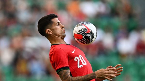 Portugal's defender #20 Joao Cancelo controls the ball during the International friendly match between Portugal and Finland at Alvalade stadium in Lisbon on June 4, 2024, ahead of the UEFA Euro 2024 football tournament in Germany. (Photo by PATRICIA DE MELO MOREIRA / AFP)