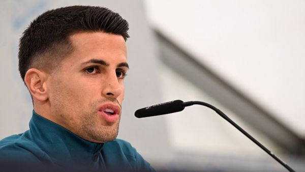 Portugal's defender #20 Joao Cancelo addresses a press conference at the media centre at the team base in Harsewinkel, western Germany on June 16, 2024, during the UEFA Euro 2024 football Championship. (Photo by PATRICIA DE MELO MOREIRA / AFP)