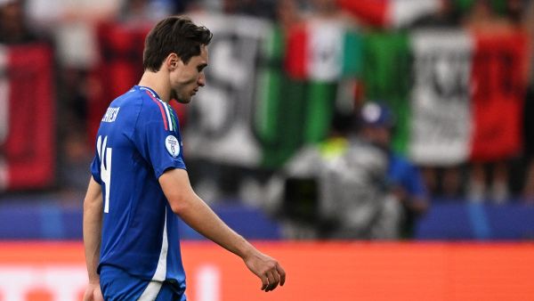 Italy's forward #14 Federico Chiesa reacts at the end of the UEFA Euro 2024 round of 16 football match between Switzerland and Italy at the Olympiastadion Berlin in Berlin on June 29, 2024. (Photo by Kirill KUDRYAVTSEV / AFP)