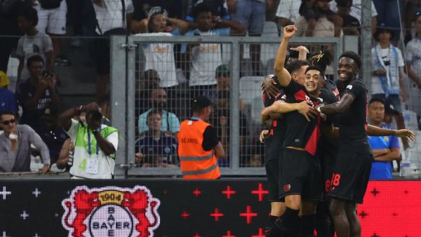 Bayer Leverkusen's players celebrate scoring their first goal during the pre-season friendly football match between Olympique Marseille (OM) and Bayer Leverkusen at the Stade Velodrome in Marseille, southern France on August 2, 2023. (Photo by CLEMENT MAHOUDEAU / AFP)