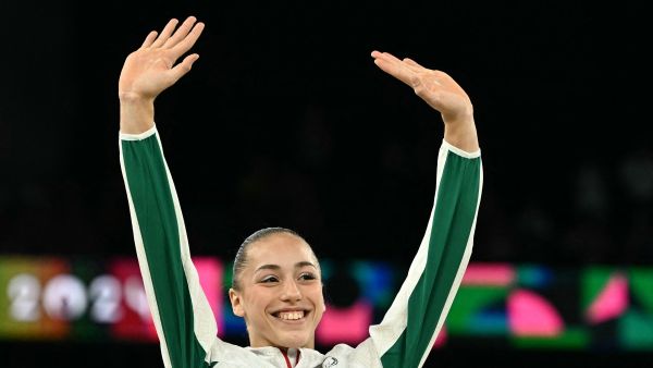Gold medallist Algeria's Kaylia Nemour poses during the podium ceremony for the artistic gymnastics women's uneven bars event of the Paris 2024 Olympic Games at the Bercy Arena in Paris, on August 4, 2024. (Photo by Lionel BONAVENTURE / AFP)