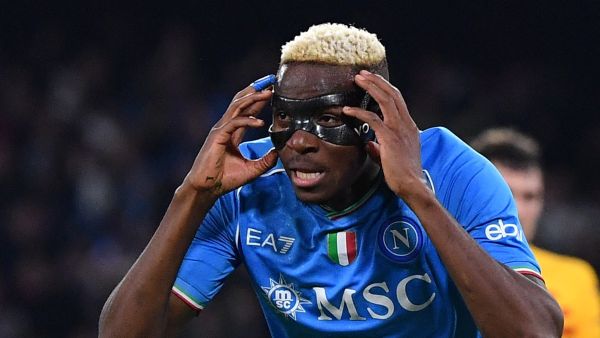 Napoli's Nigerian forward #09 Victor Osimhen celebrates after scoring a goal during the UEFA Champions League round of 16 first Leg football match between Napoli and Barcelona at the Diego-Armando-Maradona stadium in Naples on February 21, 2024. (Photo by Tiziana FABI / AFP)