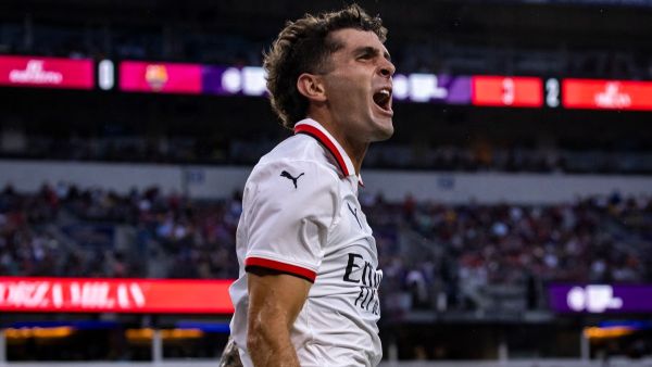AC Milan's American forward #11 Christian Pulisic celebrates after scoring a goal during the pre-season club friendly football match between Barcelona and AC Milan at M&T Bank Stadium in Baltimore, Maryland, August 6, 2024. (Photo by SAMUEL CORUM / AFP)
