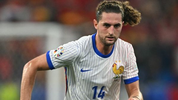 France's midfielder #14 Adrien Rabiot runs with the ball during the UEFA Euro 2024 semi-final football match between Spain and France at the Munich Football Arena in Munich on July 9, 2024. (Photo by Fabrice COFFRINI / AFP)