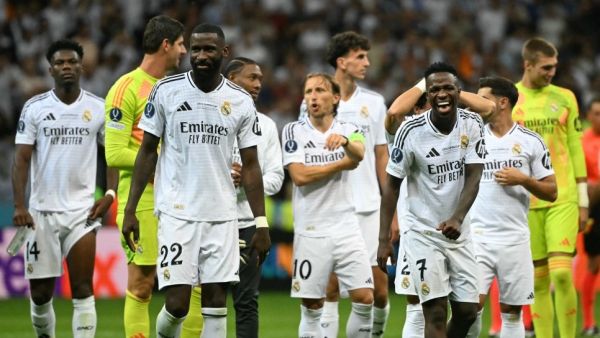 Real Madrid's players react after the UEFA Super Cup football match between Real Madrid and Atalanta BC in Warsaw, on August 14, 2024. (Photo by Sergei GAPON / AFP)
