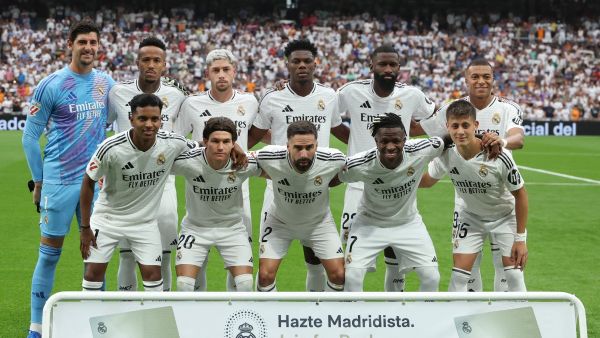 pose for a team photo before the Spanish league football match between Real Madrid CF and Real Valladolid FC at the Santiago Bernabeu stadium in Madrid on August 25, 2024. (Photo by Pierre-Philippe MARCOU / AFP)