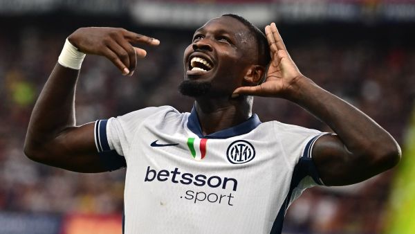 Inter Milan’s French forward #09 Marcus Thuram celebrates scoring his team's second goal during the Italian Serie A football match between Genoa and Inter Milan at the Luigi Ferraris Stadium in Genoa, on August 17, 2024. (Photo by MARCO BERTORELLO / AFP)