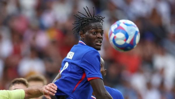 Castello Lukeba fights for the ball in the men's gold medal final football match between France and Spain during the Paris 2024 Olympic Games at the Parc des Princes in Paris on August 9, 2024. (Photo by Franck FIFE / AFP)