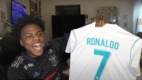 iShowSpeed holding a Ronaldo-signed jersey.