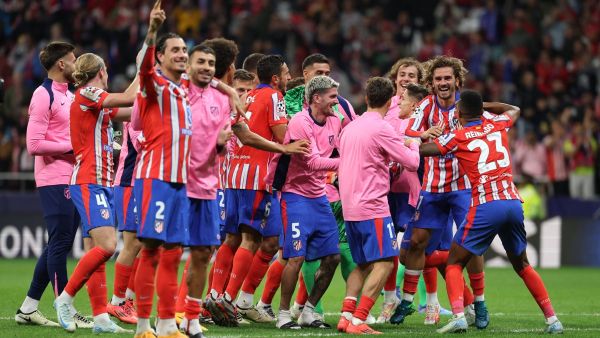Atletico Madrid players celebrate their victory at the end of the UEFA Champions League 1st round football match between Club Atletico de Madrid and RB Leipzig at the Metropolitano stadium in Madrid on September 19, 2024. (Photo by Thomas COEX / AFP)