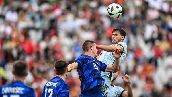 Croatia’s midfielder #15 Mario Pasalic and Portugal's defender #04 Ruben Dias jump for the ball during the international friendly football match between Portugal and Croatia at Jamor stadium in Oeiras on June 8, 2024. (Photo by PATRICIA DE MELO MOREIRA / AFP)