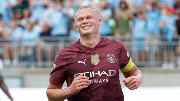 Manchester City's forward #09 Erling Haaland smiles after scoring his third goal during the second half of the pre-season club friendly football match between Chelsea FC and Manchester City FC at Ohio Stadium in Columbus, Ohio on August 3 2024. (Photo by KAMIL KRZACZYNSKI / AFP)
