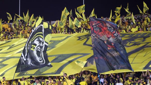 Ittihad fans cheer ahead of the Saudi Pro League football match between Al-Hilal and Al-Ittihad at the Prince Faisal bin Fahd Stadium in Riyadh on September 21, 2024. (Photo by Fayez NURELDINE / AFP)
