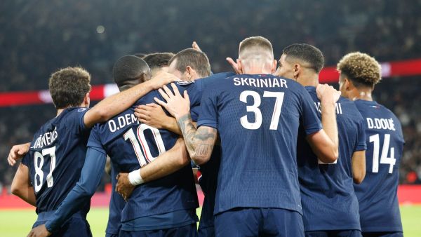 Paris Saint-Germain's players congratulate Paris Saint-Germain's Spanish midfielder #08 Fabian Ruiz after scoring PSG's second goal during the French L1 football match between Paris Saint-Germain (PSG) and Stade Brestois 29 (Brest) at The Parc des Princes Stadium, in Paris, on September 14, 2024. (Photo by GEOFFROY VAN DER HASSELT / AFP)