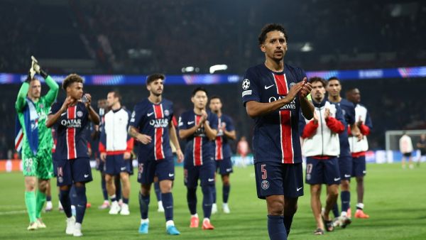 Paris Saint-Germain's Brazilian defender #05 Marquinhos (R) leads Paris Saint-Germain's players as they acknowledge the crowd at the end of the UEFA Champions League 1st round day 1 football match between Paris Saint-Germain (PSG) and Girona FC at the Parc des Princes Stadium, in Paris, on September 18, 2024. (Photo by Franck FIFE / AFP)
