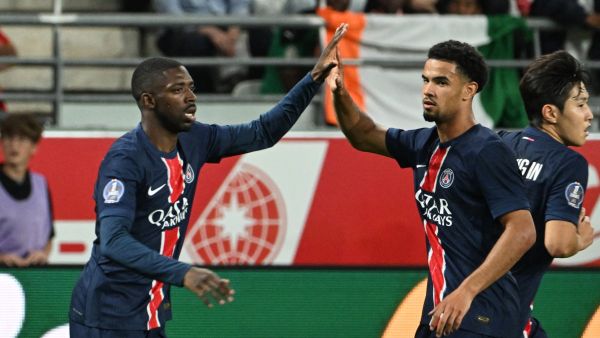 Paris Saint-Germain's French forward #10 Ousmane Dembele (L) celebrates scoring his team's first goal during the French L1 football match between Stade de Reims and Paris Saint-Germain (PSG) at Stade Auguste-Delaune in Reims, northern France on September 21, 2024. (Photo by FRANCOIS NASCIMBENI / AFP)