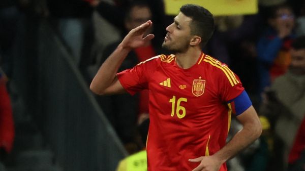 Spain's midfielder #16 Rodri celebrates scoring his team's third goal during the international friendly football match between Spain and Brazil at the Santiago Bernabeu stadium in Madrid on March 26, 2024. Spain arranged a friendly against Brazil at the Santiago Bernabeu under the slogan "One Skin" to help combat racism. (Photo by Pierre-Philippe MARCOU / AFP)