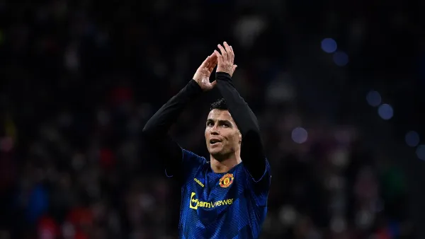 Manchester United's Portuguese forward Cristiano Ronaldo reacts at the end of the UEFA Champions League football match between Atletico de Madrid and Manchester United at the Wanda Metropolitano stadium in Madrid on February 23, 2022. (Photo by OSCAR DEL POZO / AFP)