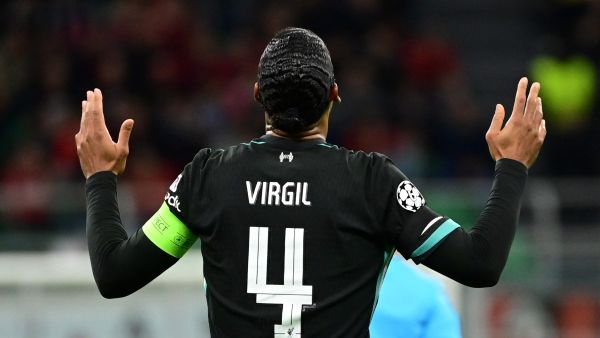 Liverpool's Dutch defender #04 Virgil van Dijk celebrates scoring his team's second goal during the UEFA Champions League 1st round day 1 football match between AC Milan and Liverpool FC at the San Siro stadium in Milan on September 17, 2024. (Photo by PIERO CRUCIATTI / AFP)