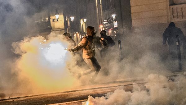 man throws a molotov coktail 