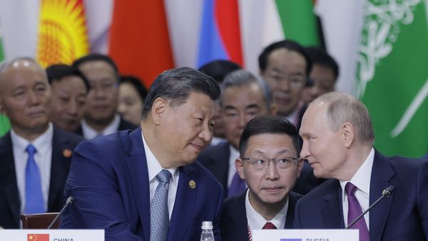 Russian President Vladimir Putin and Chinese President Xi Jinping speak during a plenary session in the outreach/BRICS Plus format at the BRICS summit in Kazan on October 24, 2024. (Photo by Maxim Shemetov / POOL / AFP) Russian President Vladimir Putin and Chinese President Xi Jinping