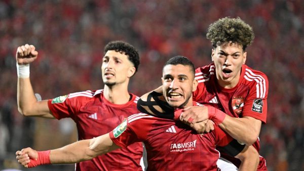 Ahly's players celebrate their team's first goal during the second leg of the CAF Champions League final football match between Egypt's Al-Ahly Tunis' Esperance Sportive de Tunis at the Cairo International stadium on May 25, 2024. (Photo by Khaled DESOUKI / AFP)