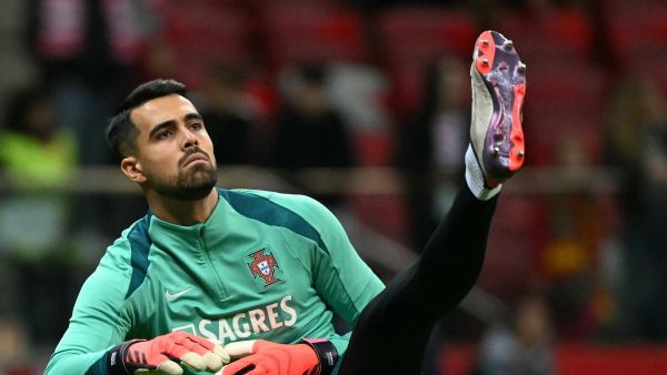 Portugal's goalkeeper #01 Diogo Costa warms up prior to the UEFA Nations League, League A Group A1 football match Poland vs Portugal at the National Stadium in Warsaw, Poland on October 12, 2024. (Photo by Sergei GAPON / AFP)