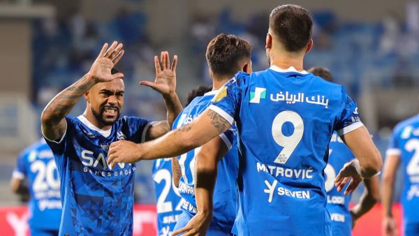 Hilal's Serbian forward #09 Aleksandar Mitrovic celebrates with his team after scoring his first goal during the Saudi Pro League football match between Al-Hilal and Al-Ittihad at the Prince Faisal bin Fahd Stadium in Riyadh on September 21, 2024. (Photo by Fayez NURELDINE / AFP)
