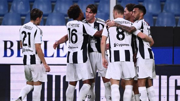 Juventus’ Serbian forward #09 Dusan Vlahovic celebrates with teammates after scoring a goal during the Italian Serie A football match bewteen Genoa and Juventus at the Luigi-Ferraris Stadium, in Genoa on September 28, 2024. (Photo by MARCO BERTORELLO / AFP)