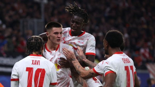 RB Leipzig's Slovenian forward #30 Benjamin Sesko (2nd L) celebrates with teammates after scoring his team's second goal during the UEFA Champions League football match between RB Leipzig and Juventus FC at the Red Bull Arena in Leipzig on October 2, 2024. (Photo by Ronny HARTMANN / AFP)