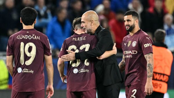 Manchester City's Spanish manager Pep Guardiola (2R) celebrates with Manchester City's English midfielder #87 James McAtee and team mates after the UEFA Champions League football match between SK Slovan Bratislava and Manchester City in Bratislava, Slovakia on October 1, 2024. Manchester City won the match 4-0. (Photo by Joe Klamar / AFP)