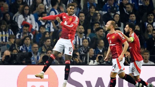 Manchester United's English forward #10 Marcus Rashford celebrates scoring the opening goal during the UEFA Europa League 1st round day 2 between FC Porto and Manchester United at the Dragao stadium in Porto on October 3, 2024. (Photo by MIGUEL RIOPA / AFP)