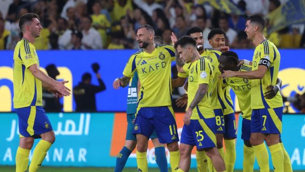 Nassr's Portuguese forward #07 Cristiano Ronaldo celebrates with teammates after their third goal in the Saudi Pro League football match between Al-Nassr and Al-Orobah at Al-Awwal Park in Riyadh on October 5, 2024. (Photo by Fayez NURELDINE / AFP)