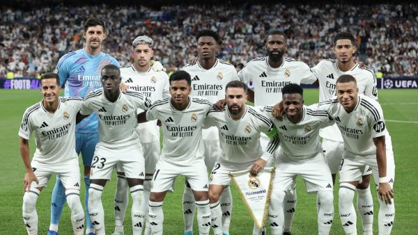 Real Madrid's players pose for a team picture before the start of during the UEFA Champions League 1st round day 1 football match between Real Madrid CF and Stuttgart VFB at the Santiago Bernabeu stadium in Madrid on September 17, 2024. (Photo by Thomas COEX / AFP)