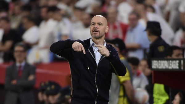 Manchester United's Dutch manager Erik ten Hag gestures during the UEFA Europa league quarter final second Leg football match between Sevilla and Manchester United at the Ramon Sanchez-Pizjuan stadium in Seville on April 20, 2023. (Photo by CRISTINA QUICLER / AFP)