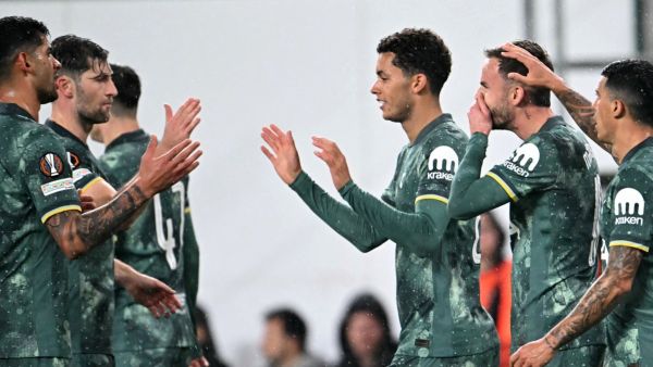 Tottenham Hotspur's Welsh striker #22 Brennan Johnson (3rd R) celebrates with teammates after scoring the 2-0 goal during the UEFA Europa League football match between Ferencvarosi TC and Tottenham Hotspur in Budapest on October 3, 2024. (Photo by Attila KISBENEDEK / AFP)