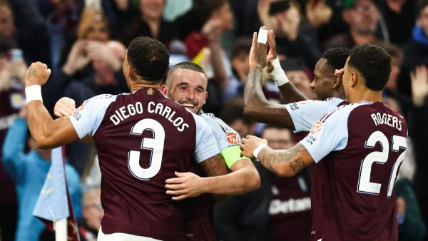 Aston Villa's Scottish midfielder #07 John McGinn (2nd L) celebrates with teammates after scoring his team first goal during the UEFA Champions League football match between Aston Villa and Bologna at Villa Park in Birmingham, central England on October 22, 2024. (Photo by Darren Staples / AFP)