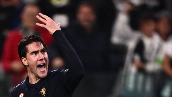 Juventus’ Serbian forward #09 Dusan Vlahovic celebrates after the own goal of Lazio’s Spanish defender #34 Mario Gila during the Italian Serie A football match between Juventus and Lazio, at the Allianz Stadium, in Turin on October 19, 2024. (Photo by MARCO BERTORELLO / AFP)