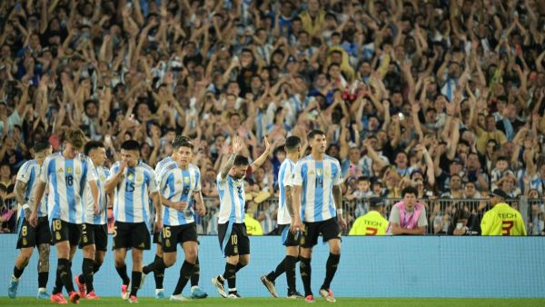 Argentina's forward #10 Lionel Messi celebrates with teammates after scoring a goal during the 2026 FIFA World Cup South American qualifiers football match between Argentina and Bolivia at the Mas Monumental stadium in Buenos Aires on October 15, 2024. (Photo by JUAN MABROMATA / AFP)