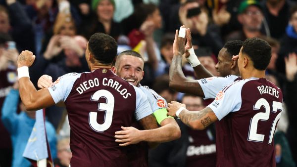 Aston Villa's Scottish midfielder #07 John McGinn (2nd L) celebrates with teammates after scoring his team first goal during the UEFA Champions League football match between Aston Villa and Bologna at Villa Park in Birmingham, central England on October 22, 2024. (Photo by Darren Staples / AFP)